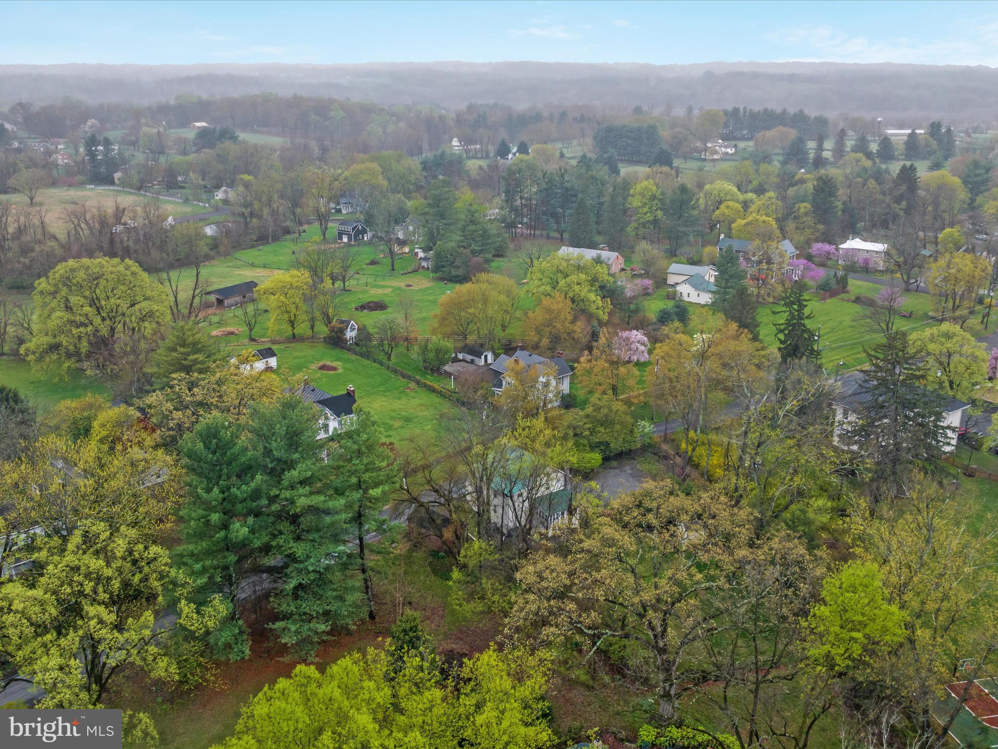 36610 Philomont Road Purcellville, VA 20132 - Photo 40 of 61 a view of a city with lush green forest
