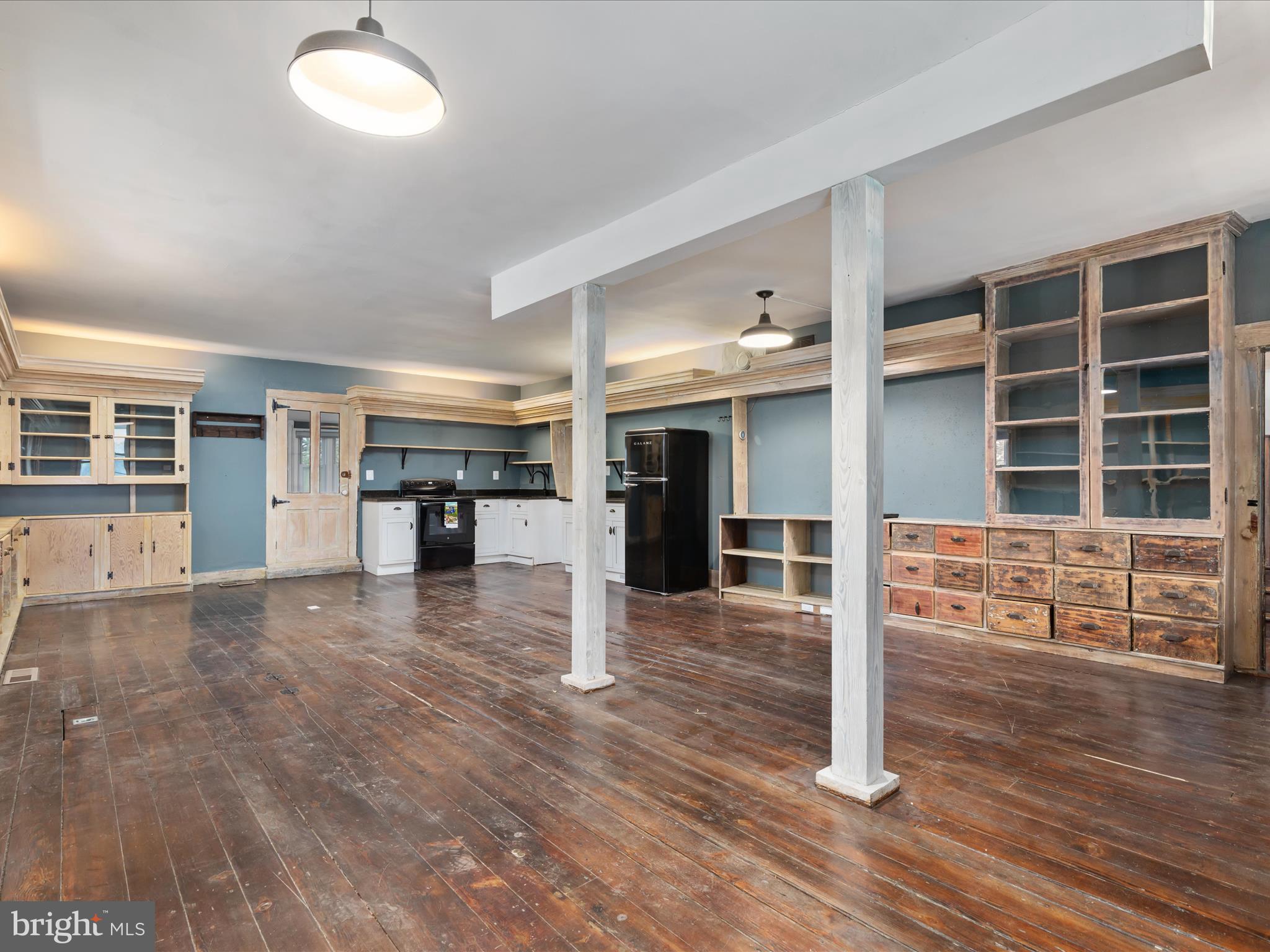 36610 Philomont Road Purcellville, VA 20132 - Photo 5 of 61 an empty room with wooden floor and windows