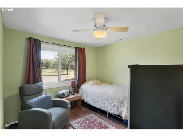 a bedroom with a bed and window