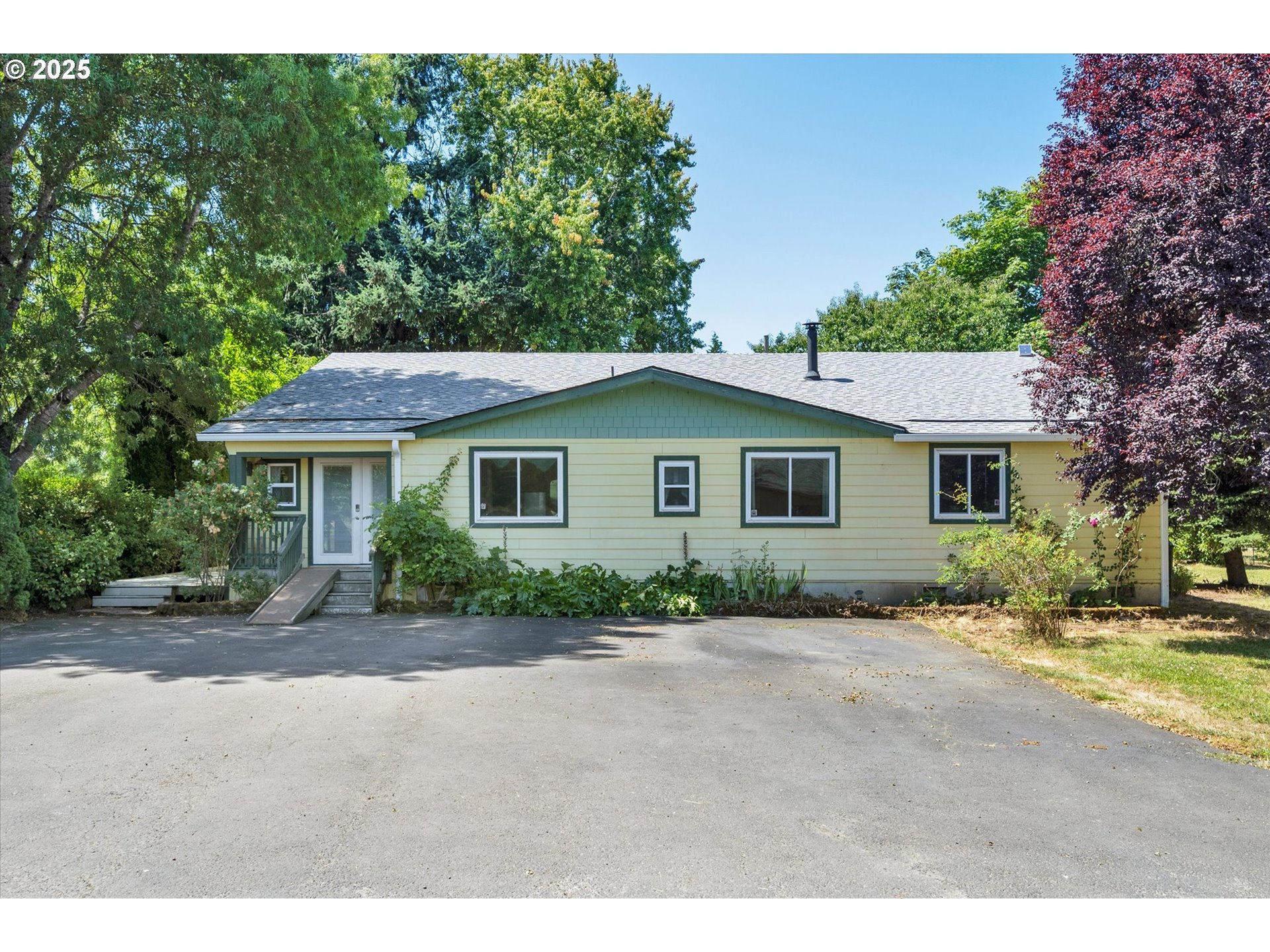 10025 Northeast Ward Road Brush Prairie, WA 98606 - Photo 3 of 33 a view of a house with a backyard