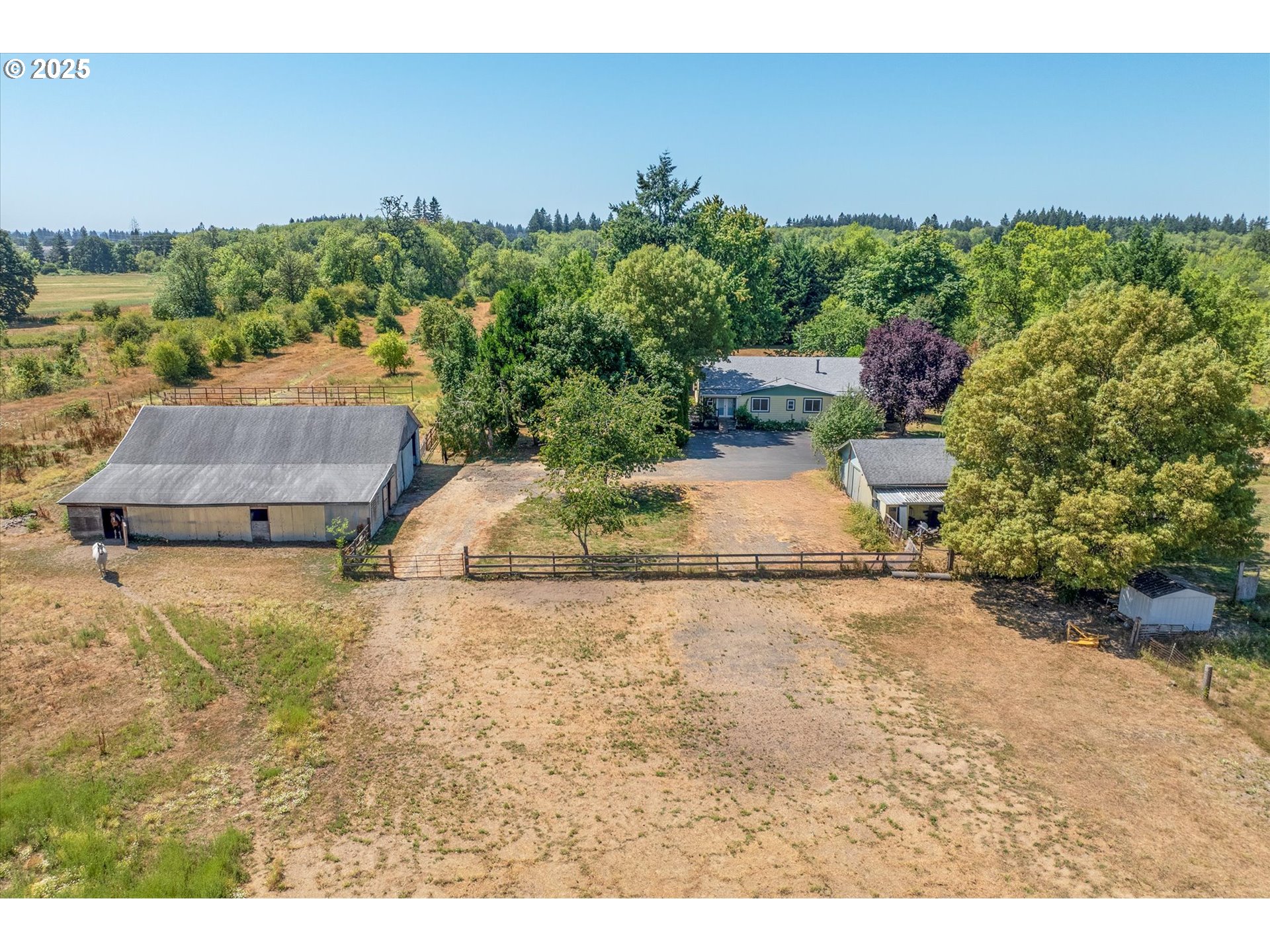 10025 Northeast Ward Road Brush Prairie, WA 98606 - Photo 33 of 33 an aerial view of a house with a yard and greenery