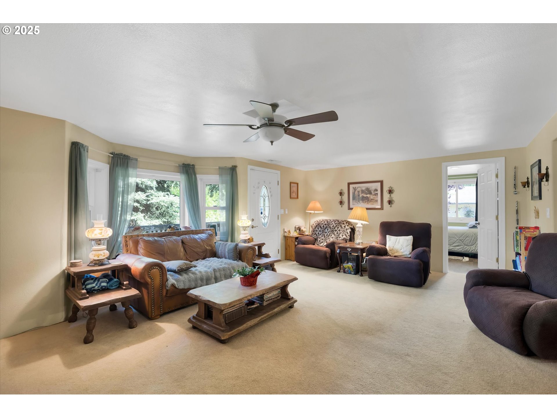 10025 Northeast Ward Road Brush Prairie, WA 98606 - Photo 5 of 33 a living room with furniture ceiling fan and a window