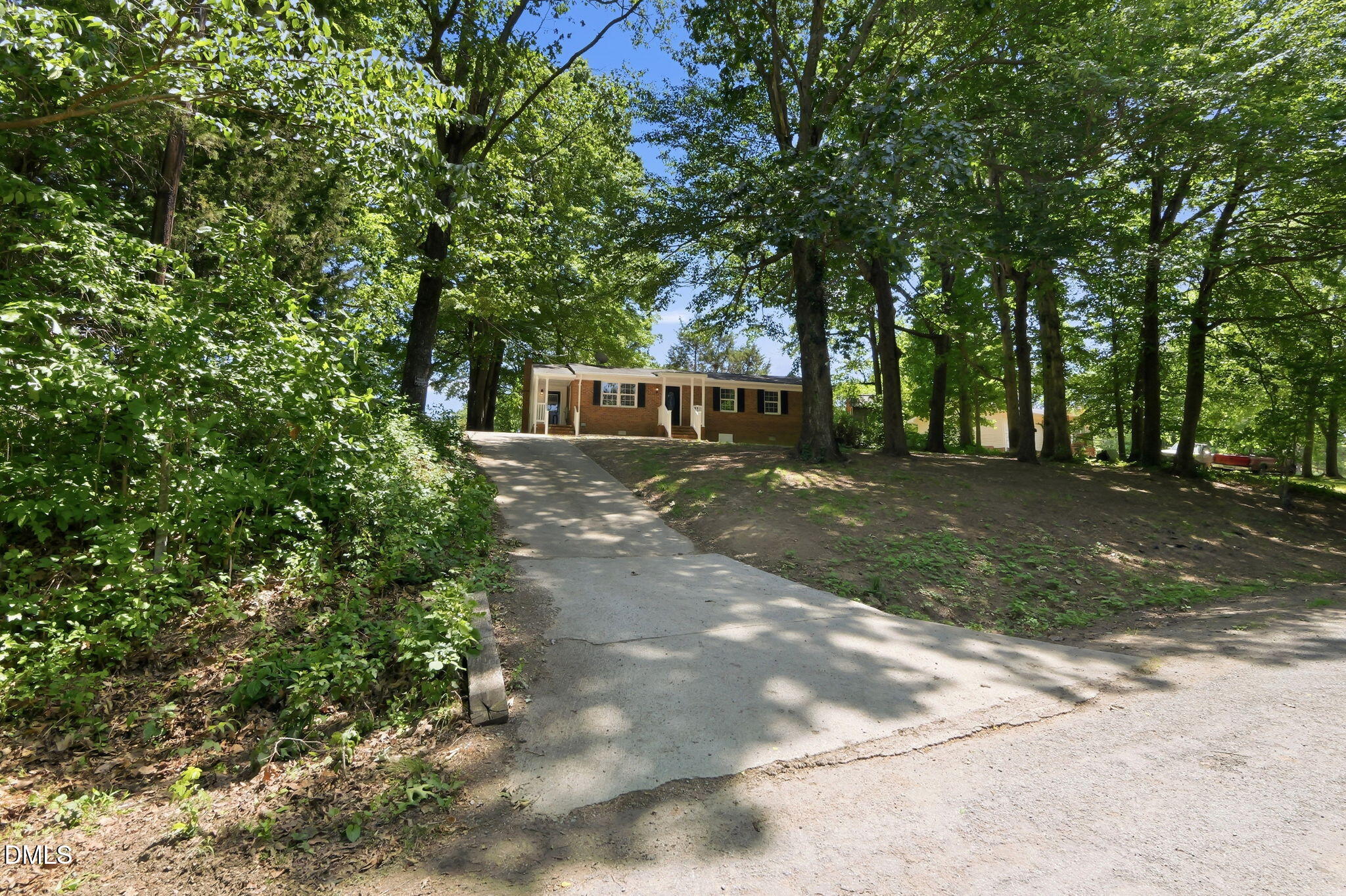 265 Shady Hill Circle Roxboro, NC 27573 - Photo 18 of 18 a view of a house with a yard