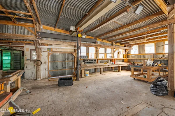 a living room with a flat screen tv and rug