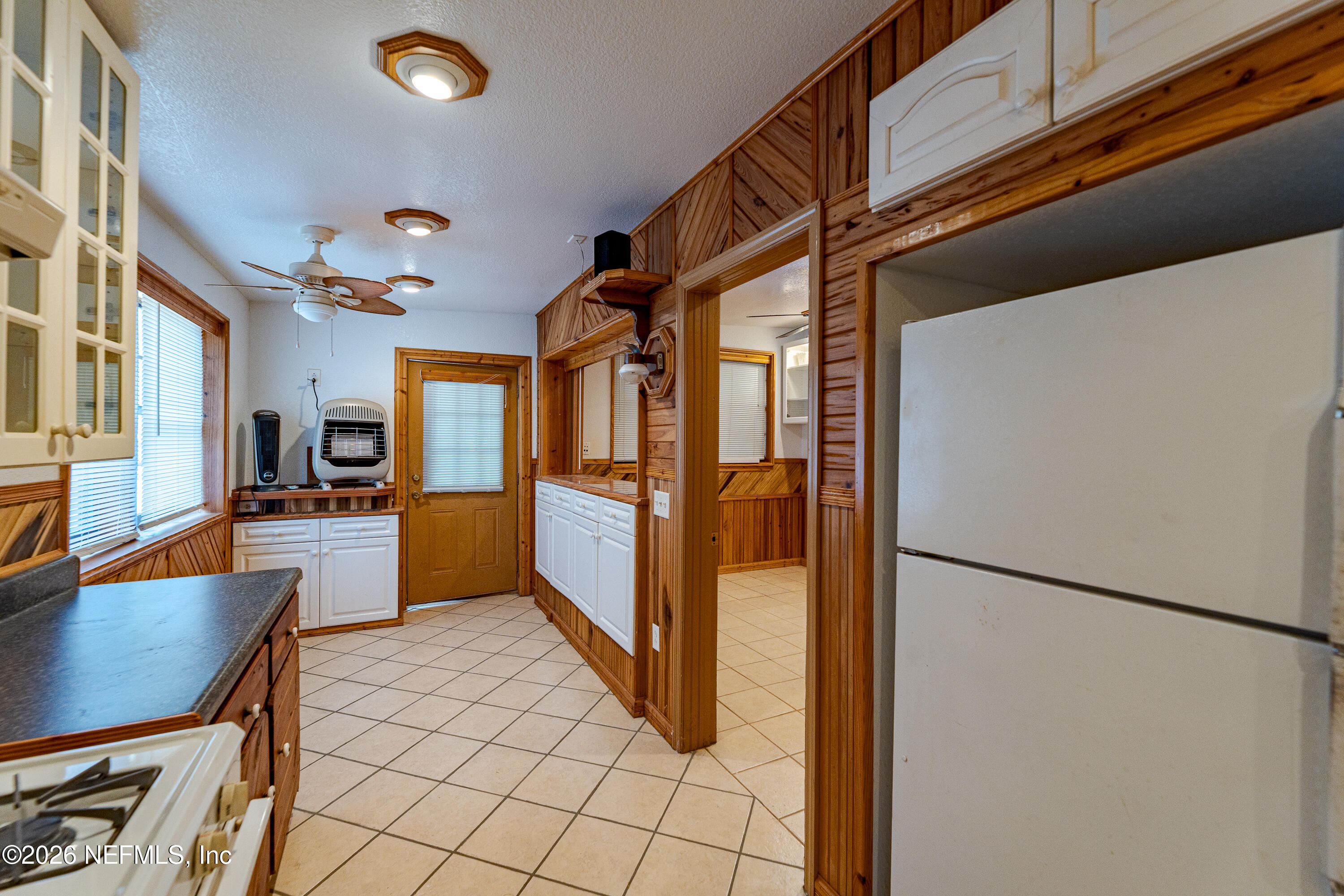 11053 Mulberry Landing Road Hilliard, FL 32046 - Photo 20 of 107 a view of a kitchen with furniture and a refrigerator