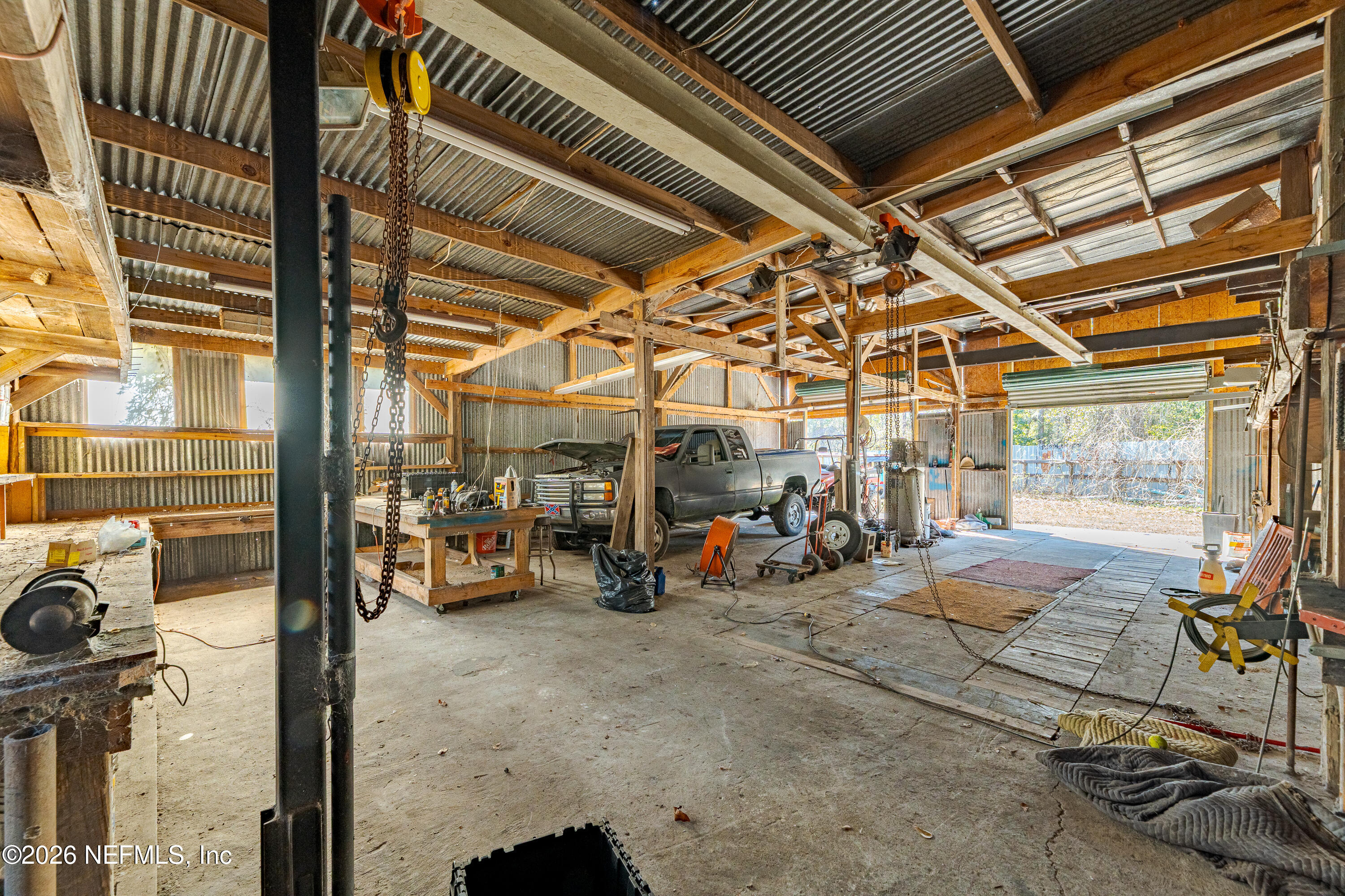 11053 Mulberry Landing Road Hilliard, FL 32046 - Photo 3 of 107 a view of a garage with wooden floor