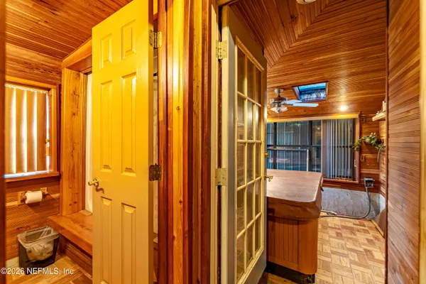 a view of outdoor space with wooden floor and a window