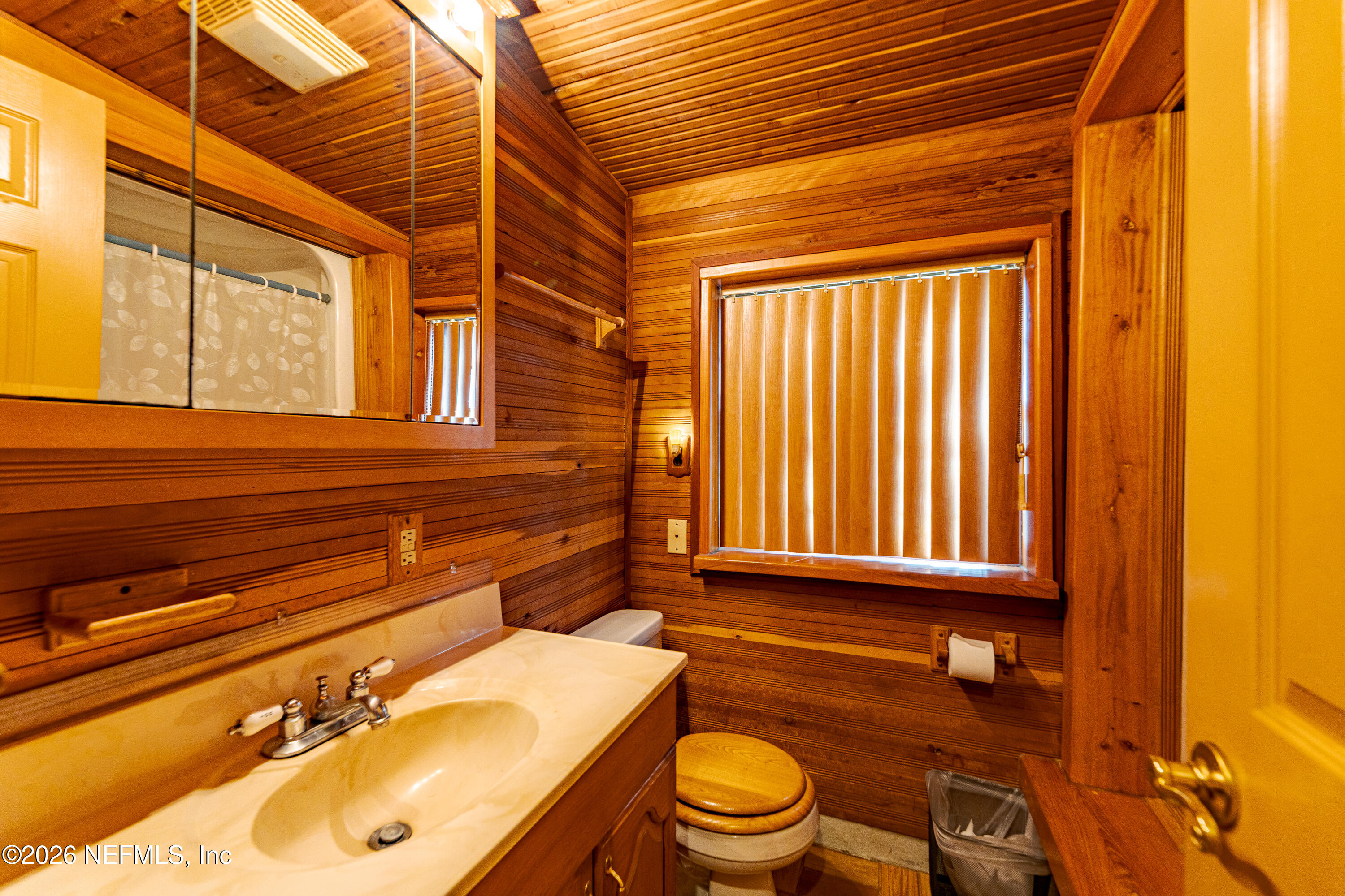 11053 Mulberry Landing Road Hilliard, FL 32046 - Photo 38 of 107 a bathroom with a sink a toilet and tub