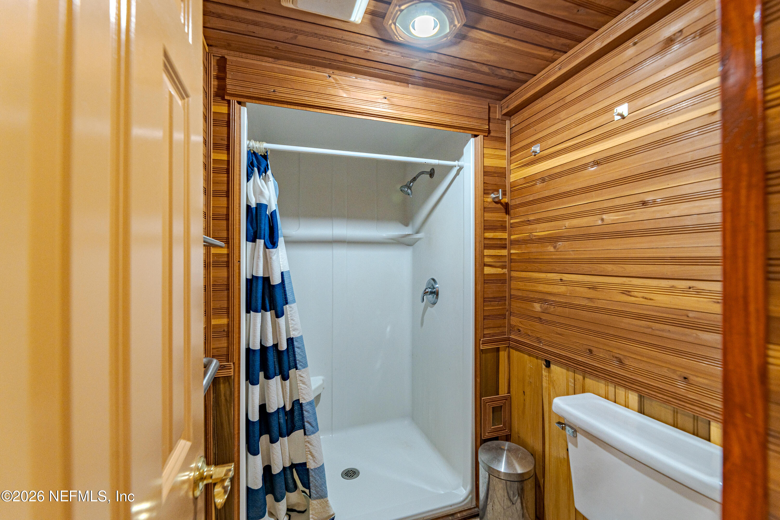 11053 Mulberry Landing Road Hilliard, FL 32046 - Photo 44 of 107 a bathroom with a toilet and a shower