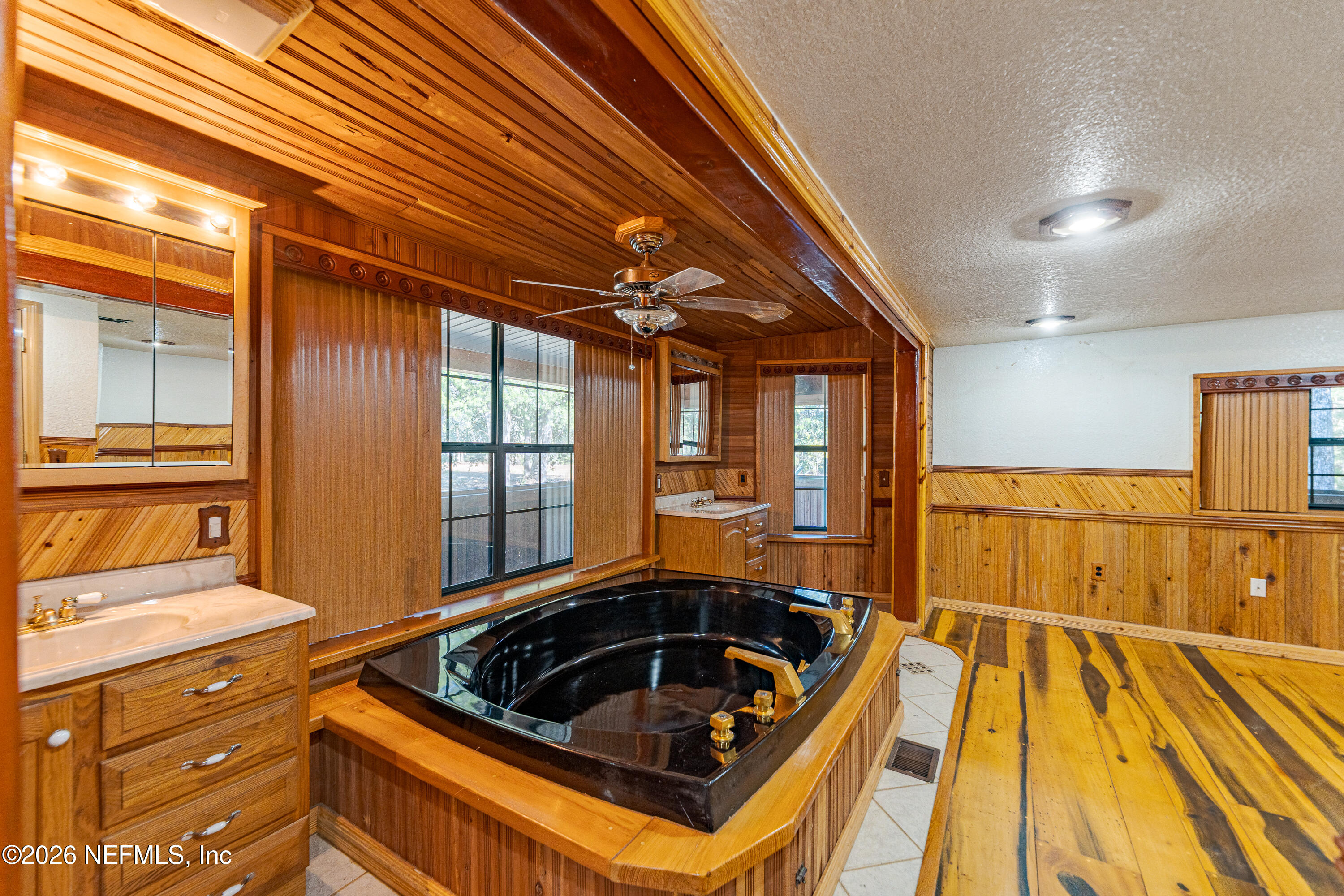 11053 Mulberry Landing Road Hilliard, FL 32046 - Photo 45 of 107 a kitchen with a sink and wooden cabinets