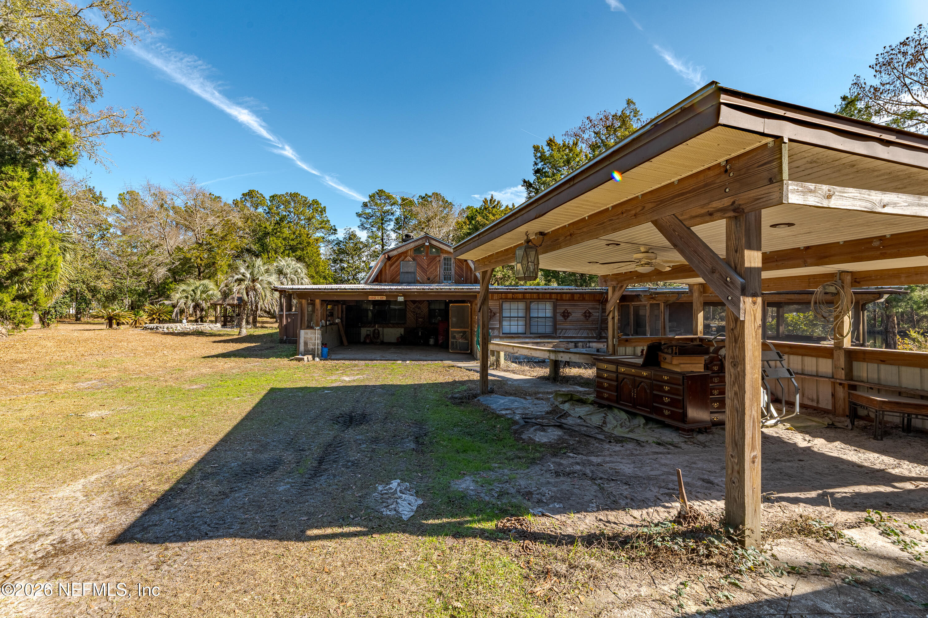 11053 Mulberry Landing Road Hilliard, FL 32046 - Photo 10 of 107 a view of a house with backyard and sitting area