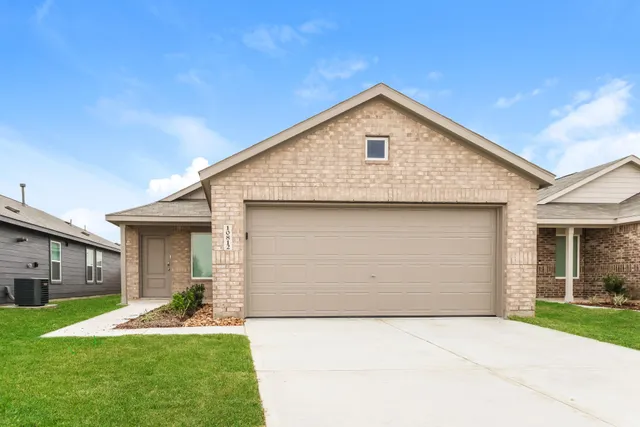 a front view of house with yard and outdoor seating