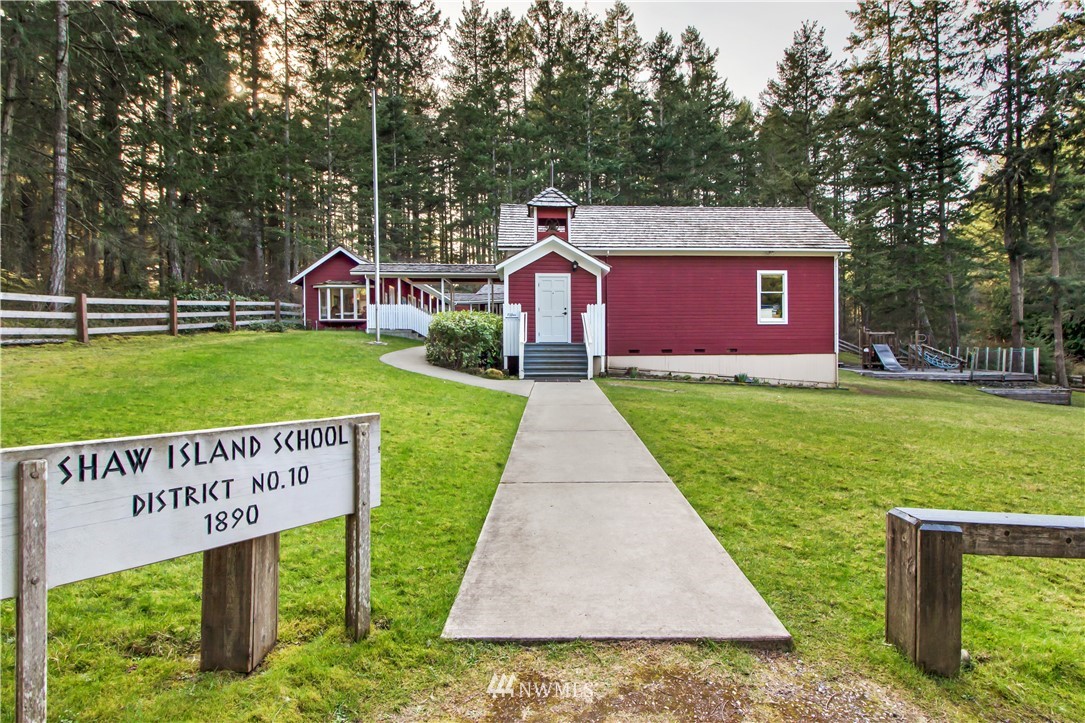 -14xx Neck Point Road Shaw Island, WA 98286 - Photo 16 of 19 a view of a sign in front of a house with a yard