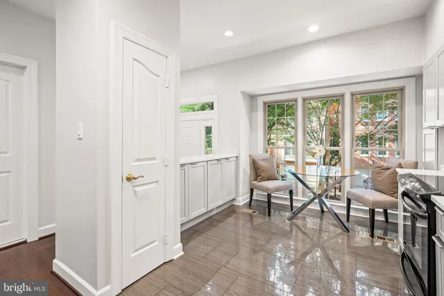 a view of a livingroom with furniture and floor to ceiling window