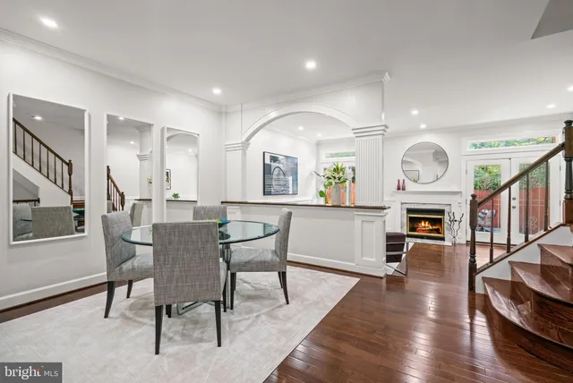 a view of a room with a ceiling fan