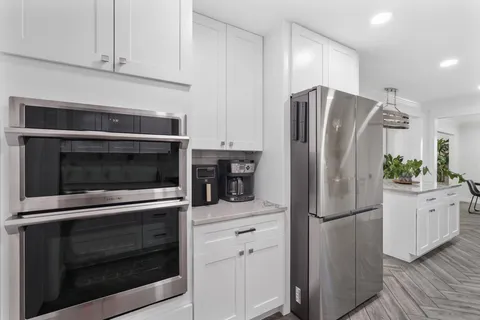 a spacious bedroom with a bed and a couch