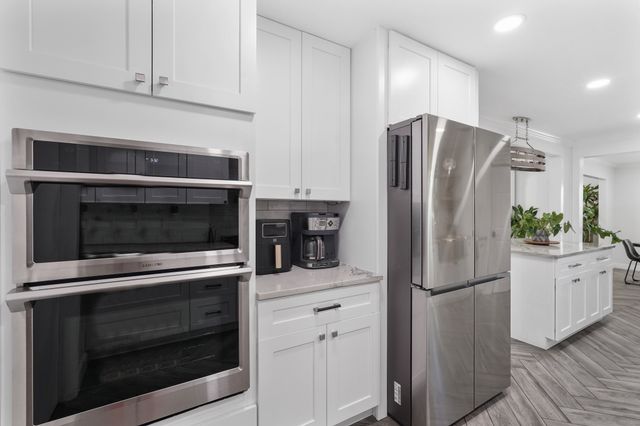 a spacious bedroom with a bed and a couch