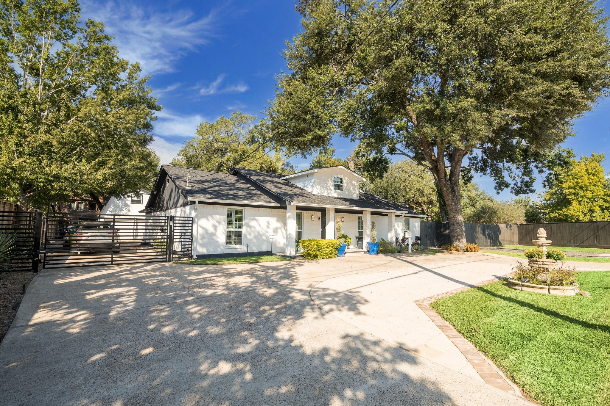 1441 Bingle Road Houston, TX 77055 - Photo 2 of 45 a front view of a house with a garden