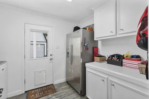 a bathroom with a granite countertop toilet a sink and mirror