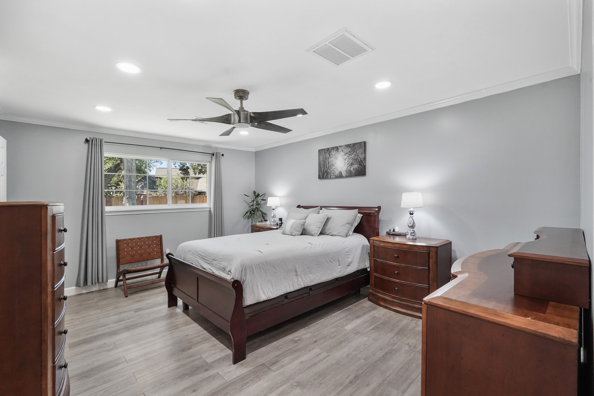 1441 Bingle Road Houston, TX 77055 - Photo 23 of 46 a spacious bedroom with a bed and a couch