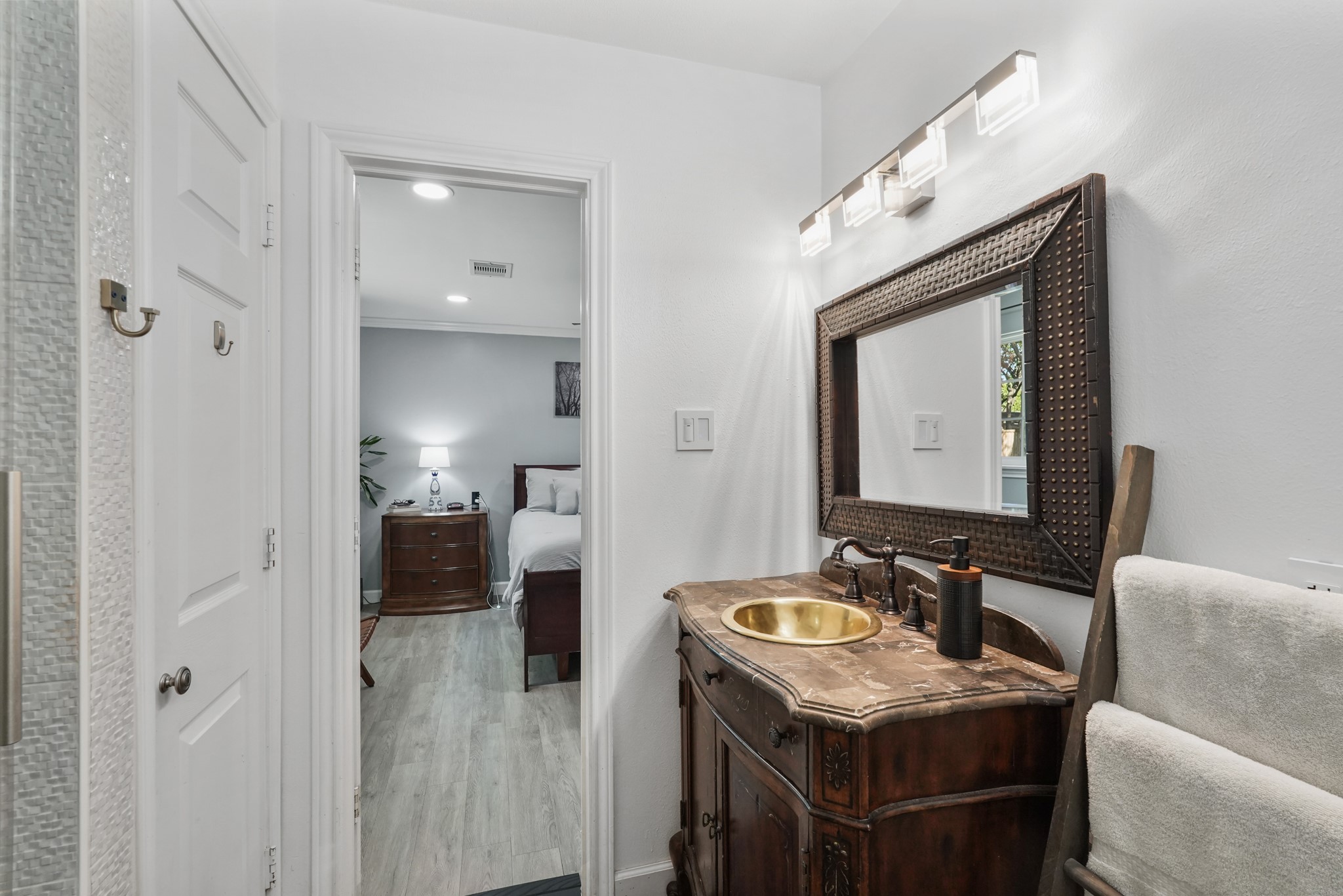 1441 Bingle Road Houston, TX 77055 - Photo 27 of 45 a en suite bathroom with a granite countertop sink and a mirror