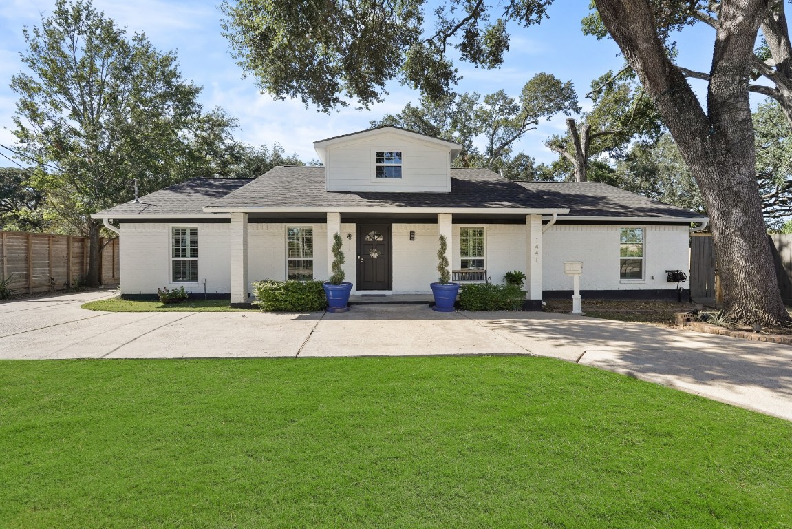1441 Bingle Road Spring Valley Village, TX 77055 - Photo 3 of 46 a front view of a house with a garden and yard
