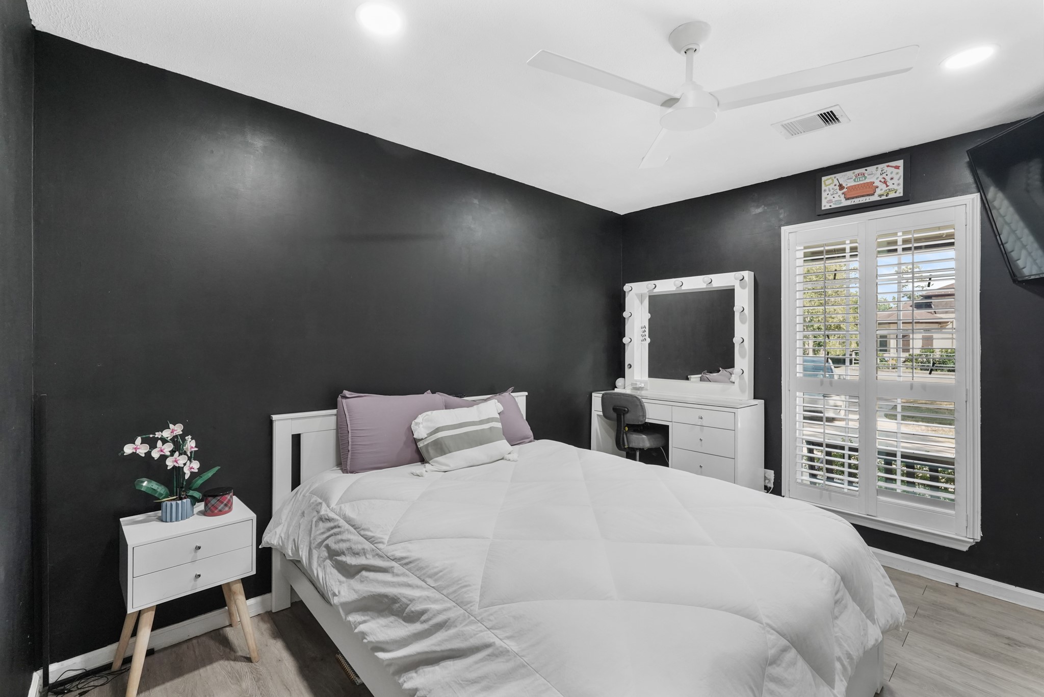 1441 Bingle Road Houston, TX 77055 - Photo 31 of 45 a bedroom with a bed and a flat screen tv