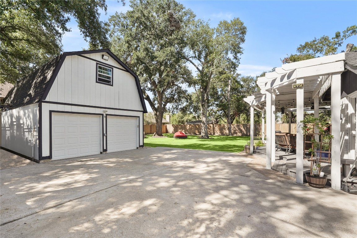 1441 Bingle Road Spring Valley Village, TX 77055 - Photo 34 of 46 a view of a white house with large trees and playing area