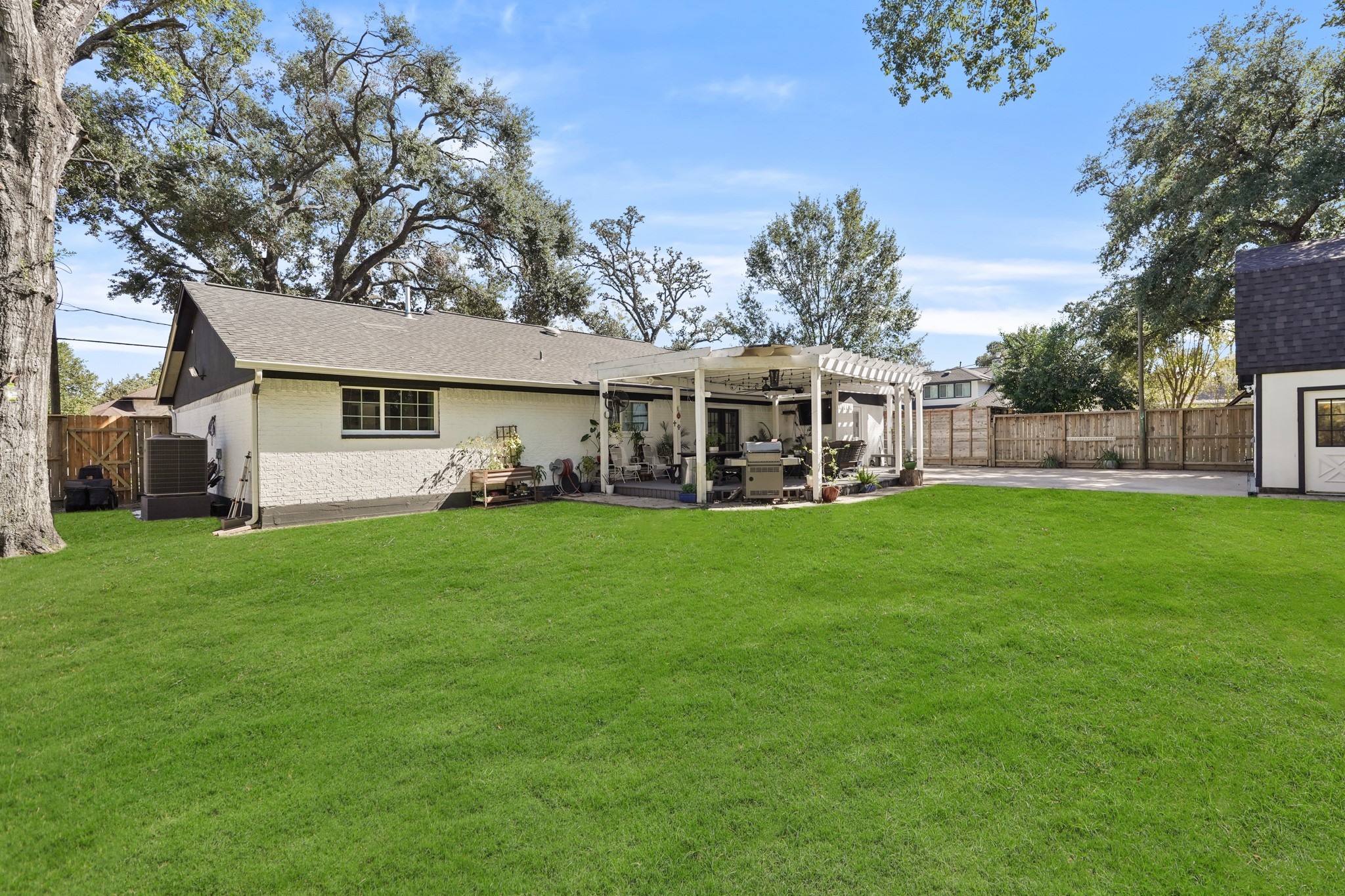 1441 Bingle Road Houston, TX 77055 - Photo 5 of 46 a view of a house with a backyard porch and sitting area