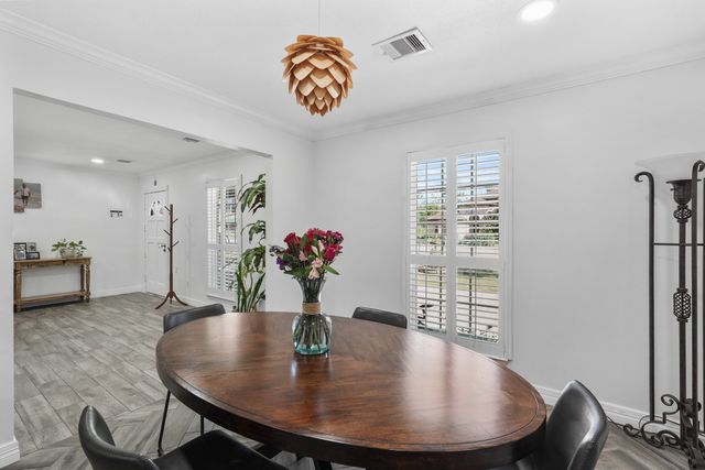 a living room with furniture a wooden floor and a fireplace