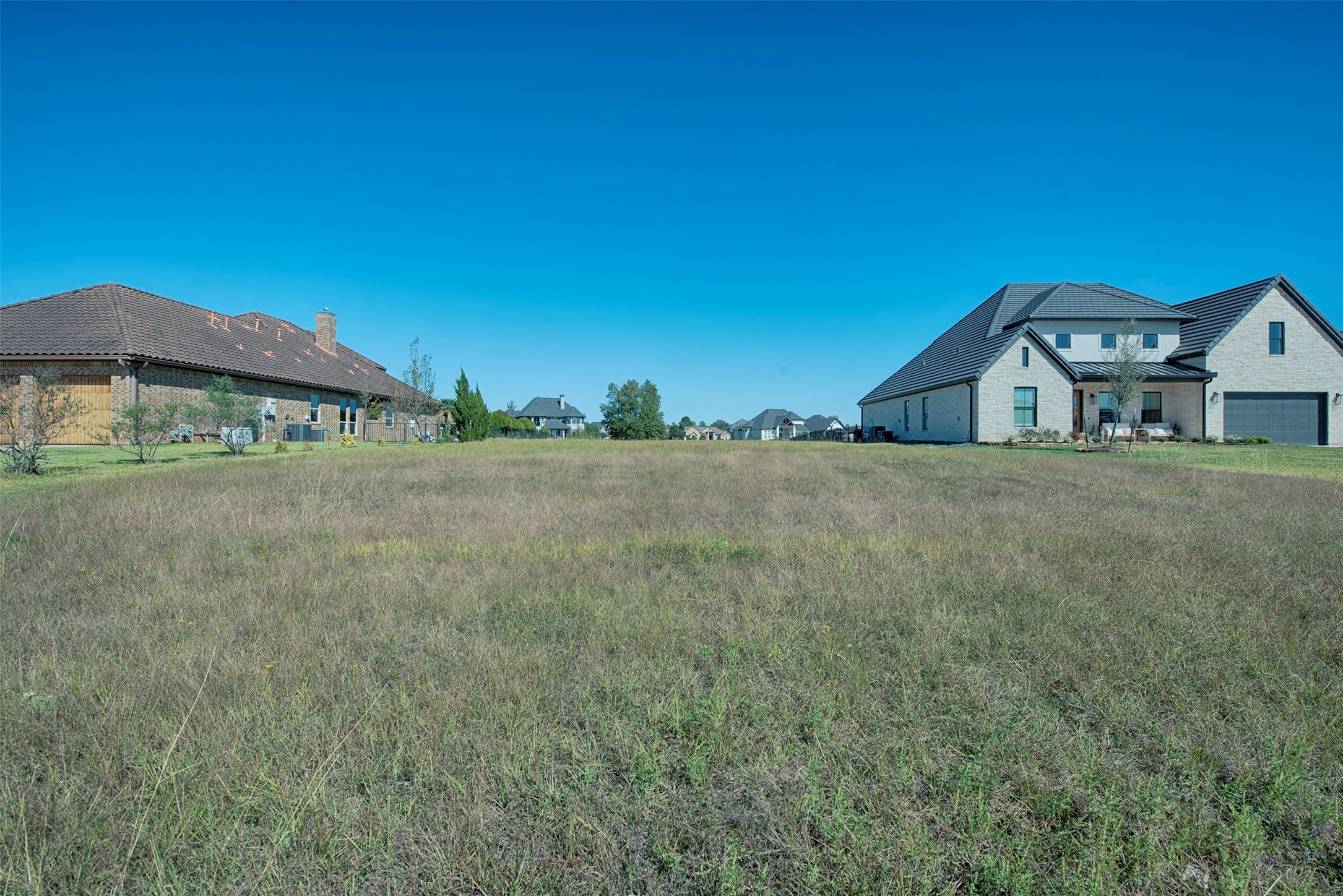 11690 Renaissance Drive Montgomery, TX 77356 - Photo 12 of 25 a view of a large house with a big yard and large trees