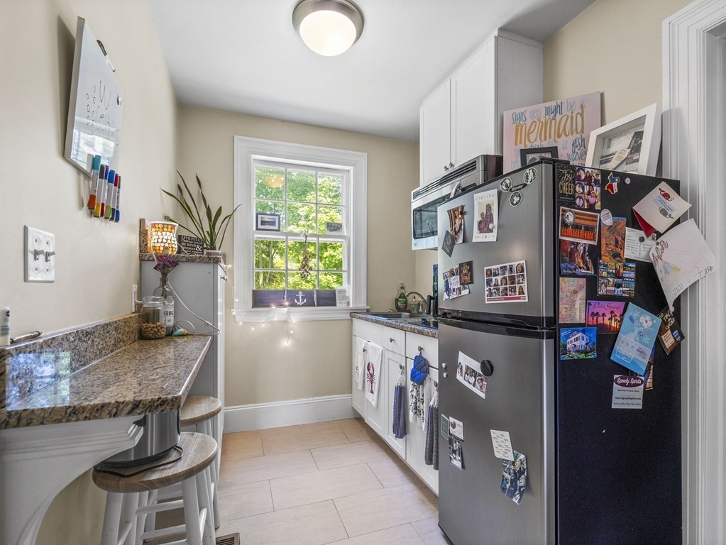6 Appleby Road Wellesley, MA 02482 - Photo 17 of 21 a kitchen with stainless steel appliances granite countertop a refrigerator and a stove