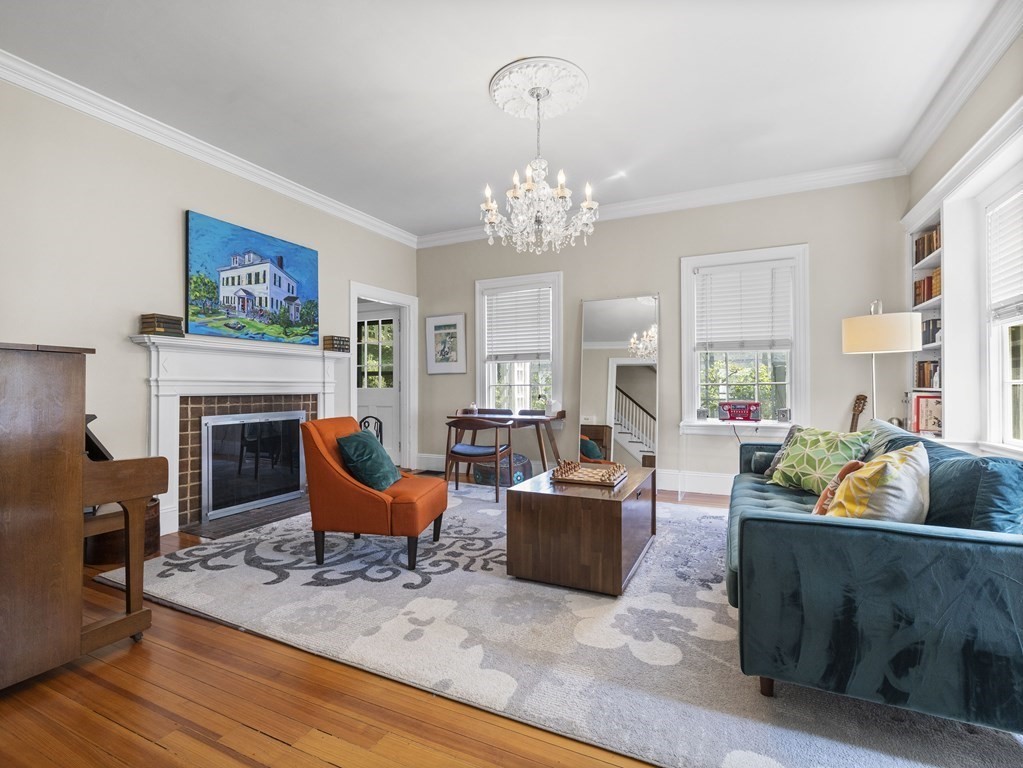 6 Appleby Road Wellesley, MA 02482 - Photo 4 of 21 a living room with furniture a fireplace and a chandelier