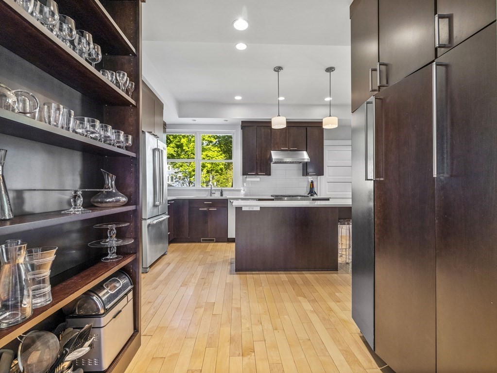 6 Appleby Road Wellesley, MA 02482 - Photo 7 of 21 a kitchen with stainless steel appliances kitchen island granite countertop a refrigerator and a stove
