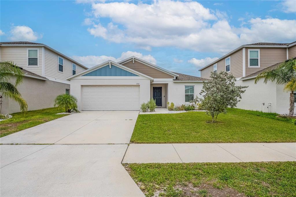 1719 Durden Road Winter Haven, FL 33880 - Photo 1 of 39 a front view of a house with a garden