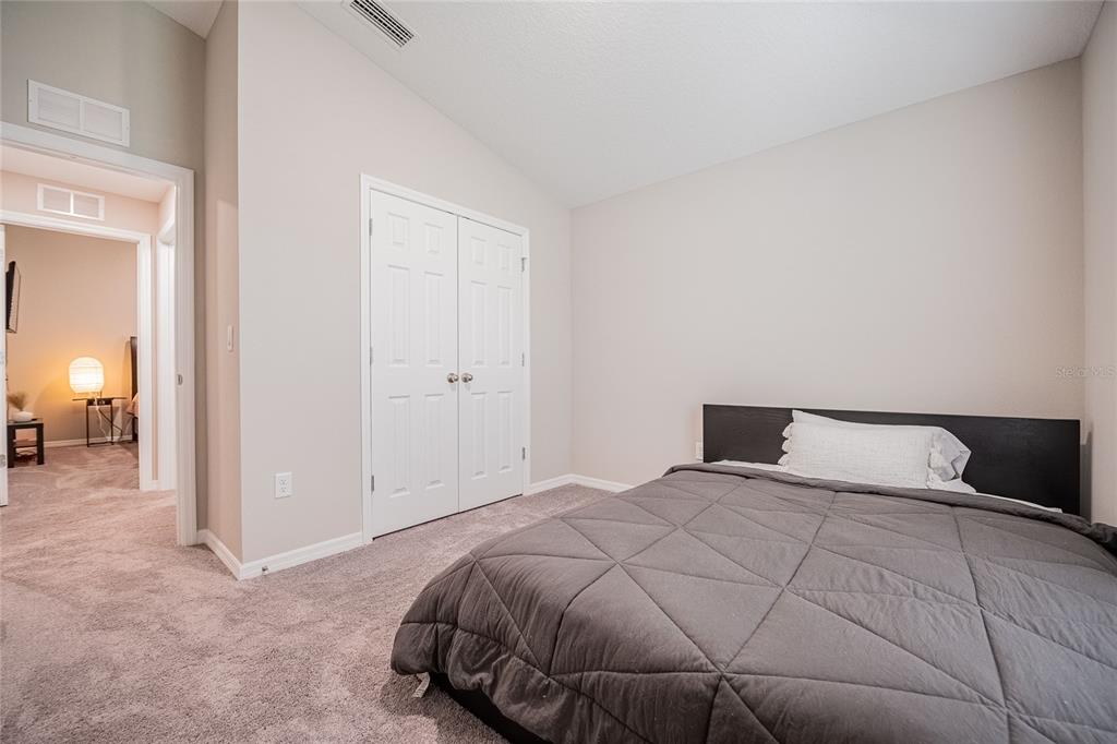 1719 Durden Road Winter Haven, FL 33880 - Photo 11 of 39 a bedroom with a bed and a mirror