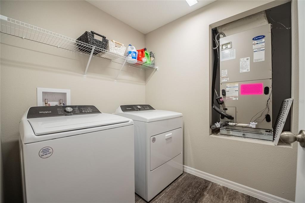 1719 Durden Road Winter Haven, FL 33880 - Photo 12 of 39 a view of storage and utility room with washer and dryer