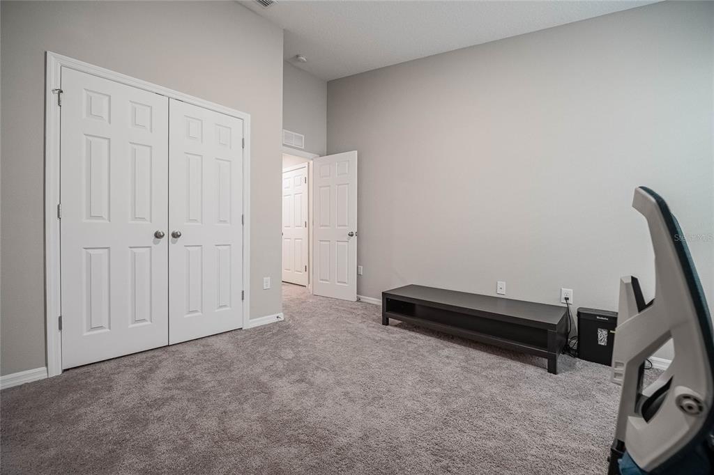 1719 Durden Road Winter Haven, FL 33880 - Photo 14 of 39 an empty room with a bench