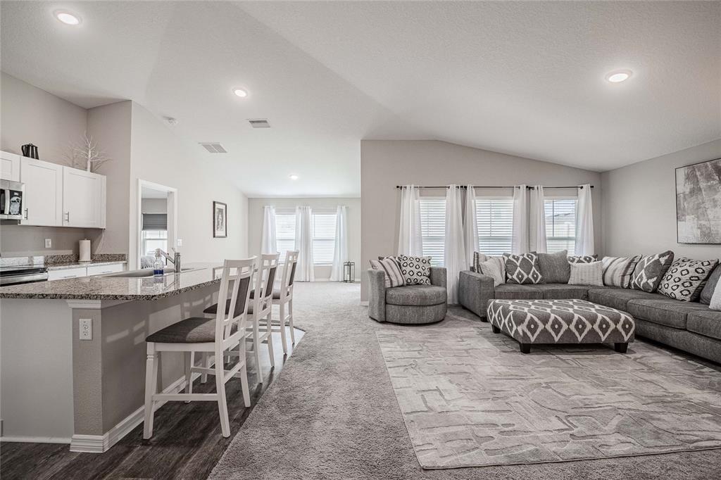 1719 Durden Road Winter Haven, FL 33880 - Photo 15 of 39 a living room with furniture and a large window