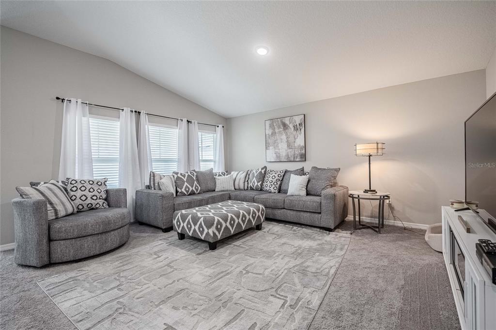 1719 Durden Road Winter Haven, FL 33880 - Photo 17 of 39 a living room with furniture and a window