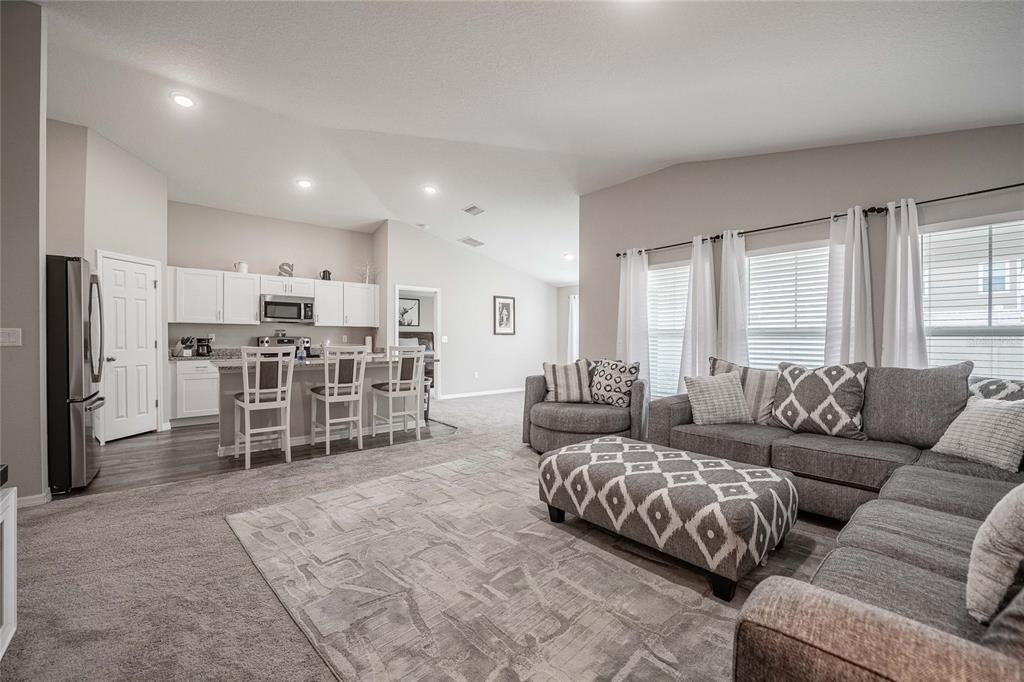 1719 Durden Road Winter Haven, FL 33880 - Photo 18 of 39 a living room with furniture and kitchen view