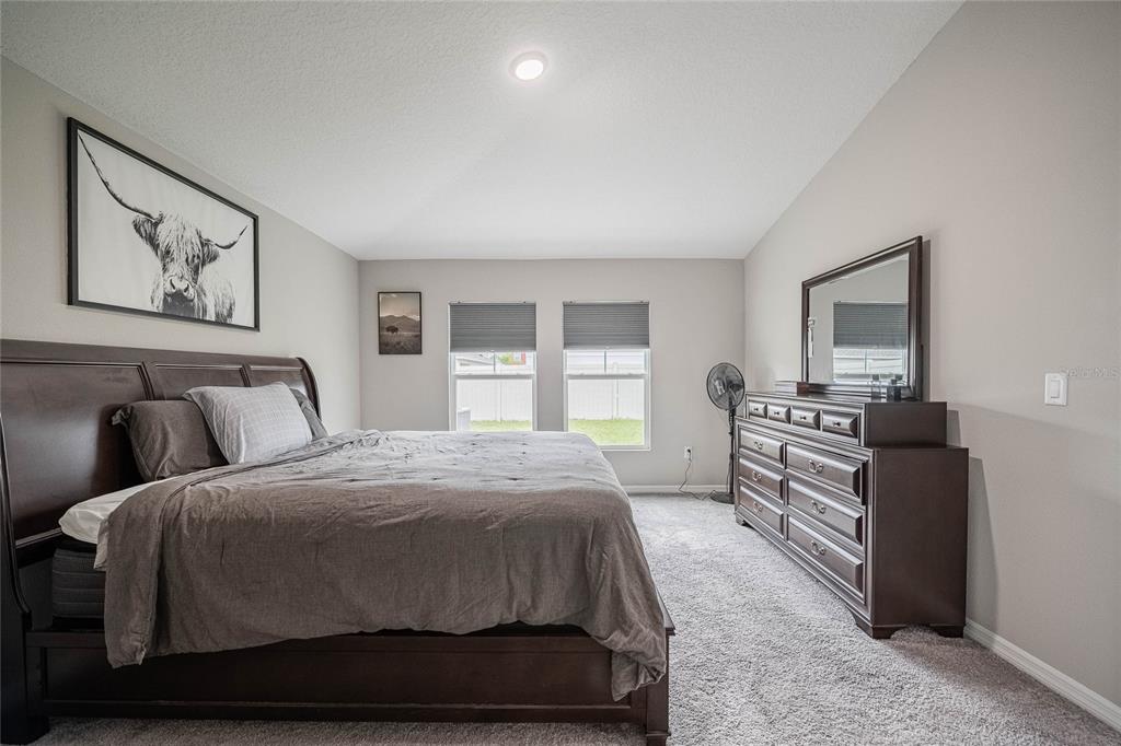 1719 Durden Road Winter Haven, FL 33880 - Photo 27 of 39 a bedroom with a bed and a window