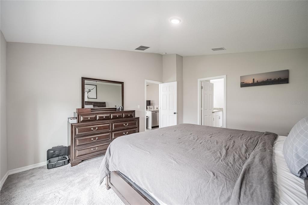 1719 Durden Road Winter Haven, FL 33880 - Photo 28 of 39 a bedroom with a bed and a television