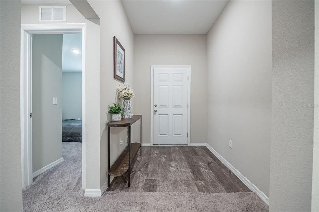 1719 Durden Road Winter Haven, FL 33880 - Photo 6 of 39 a view of a hallway and an empty room
