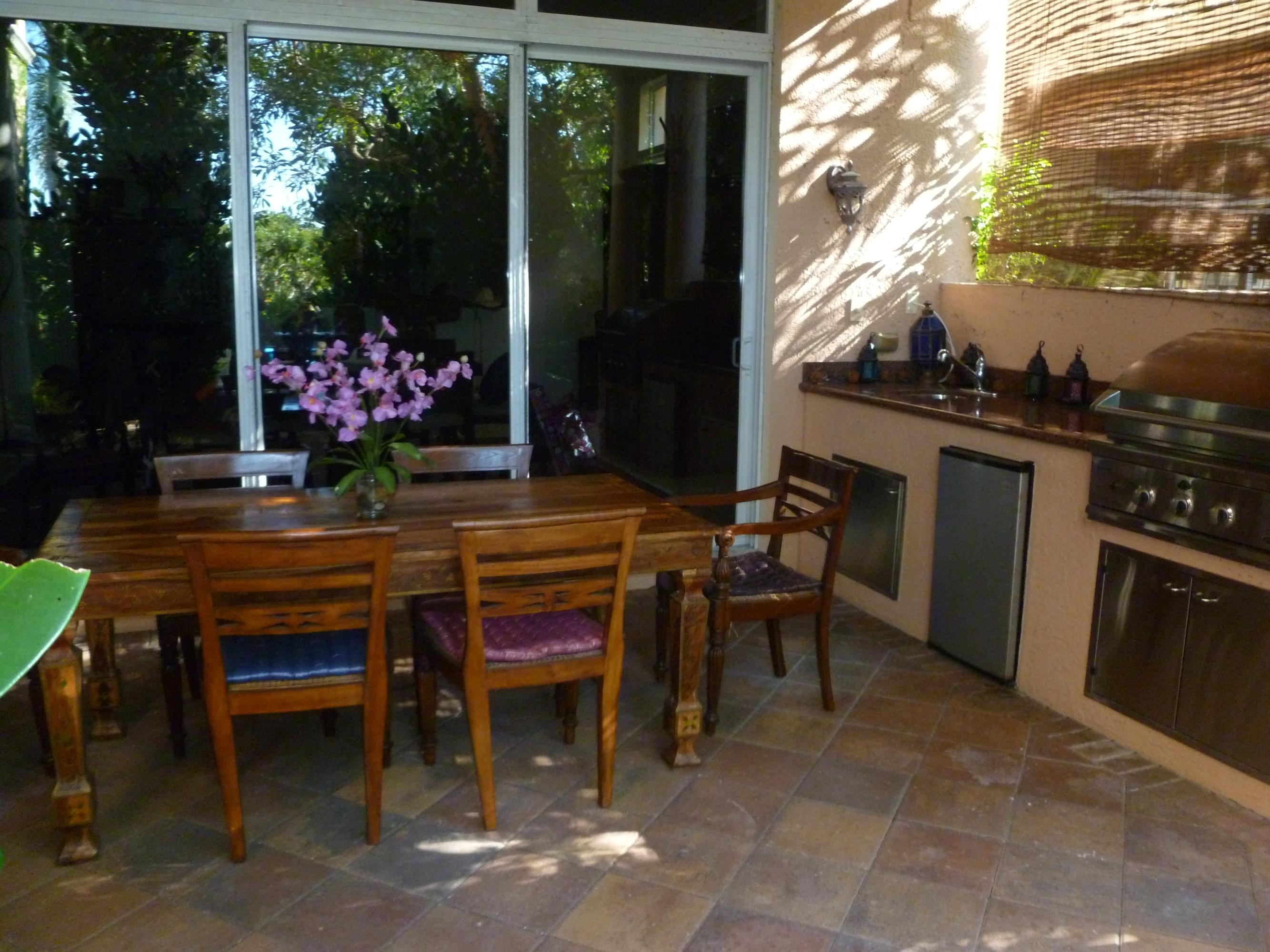 128 Tulip Tree Court Jupiter, FL 33458 - Photo 3 of 11 Covered Patio with Summer Kitchen