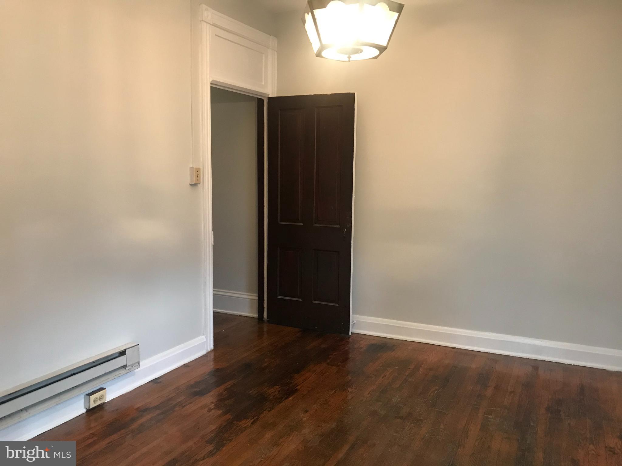 25 South Locust Street Hagerstown, MD 21740 - Photo 23 of 54 an empty room with wooden floor