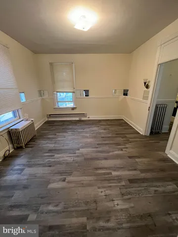 a view of a livingroom with wooden floor