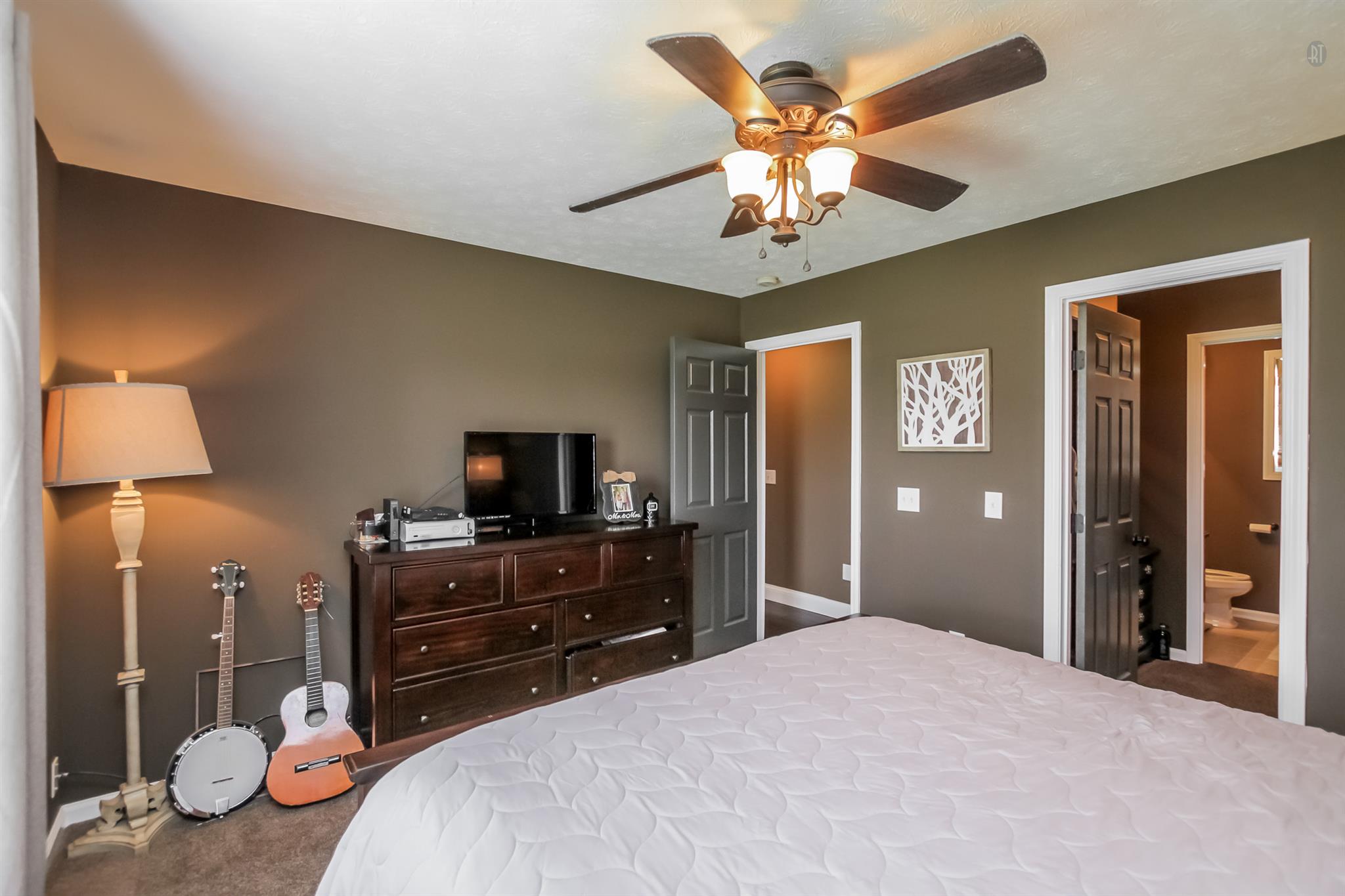 6144 South Lamont Road Springfield, TN 37172 - Photo 14 of 29 a bedroom with a bed and a flat tv screen on dresser