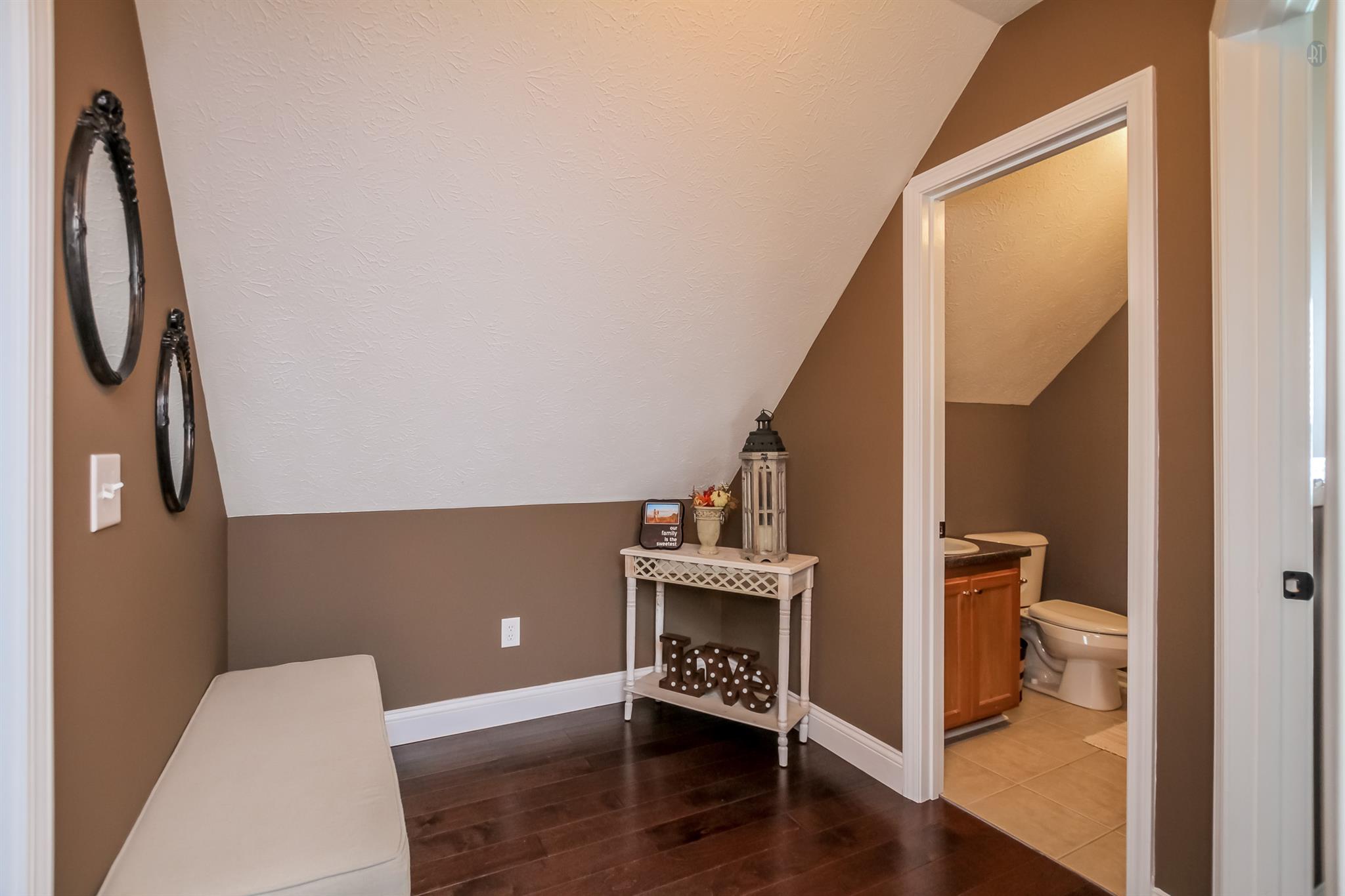 6144 South Lamont Road Springfield, TN 37172 - Photo 17 of 29 a view of an empty room with wooden floor and a window