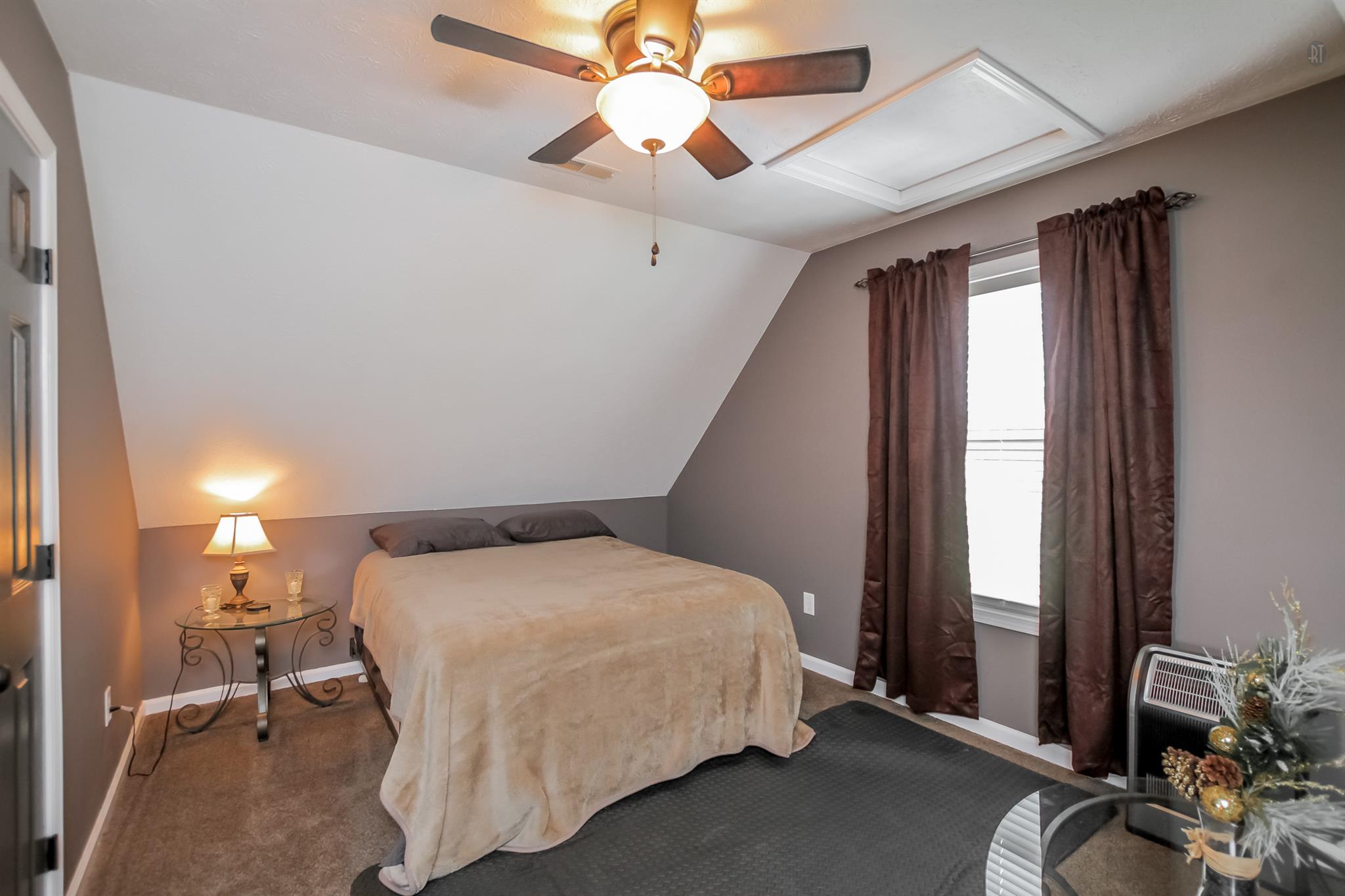 6144 South Lamont Road Springfield, TN 37172 - Photo 21 of 29 a bedroom with a bed and a chandelier